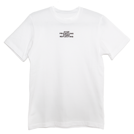 White short-sleeved t-shirt with 'Stop Projecting Start Reflecting' quote in black font on the chest, from Maple and Rhine.