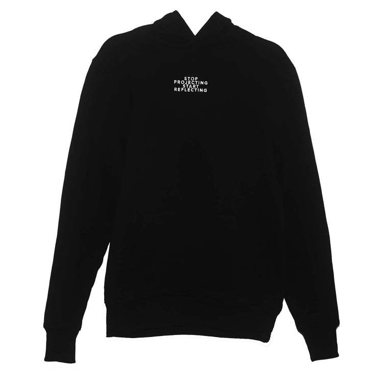 Cozy black pullover hoodie with a front pocket and 'Stop Projecting Start Reflecting' message in white, promoting self-awareness and reflection, by Maple and Rhine.